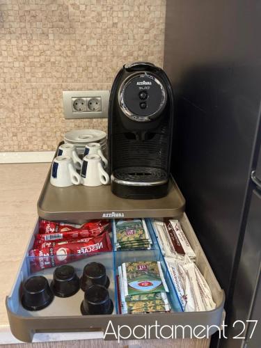 a refrigerator with a cell phone on top of it at Apartamente Felix in Baile Felix