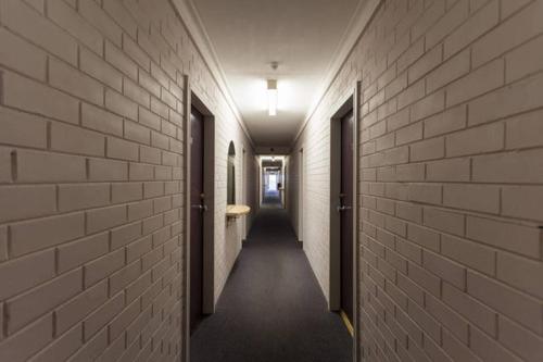 a corridor of a hallway of a building at H & D Apartments in Melbourne
