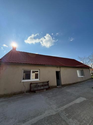 a building with a bench in front of it at Bodenik in Bileća