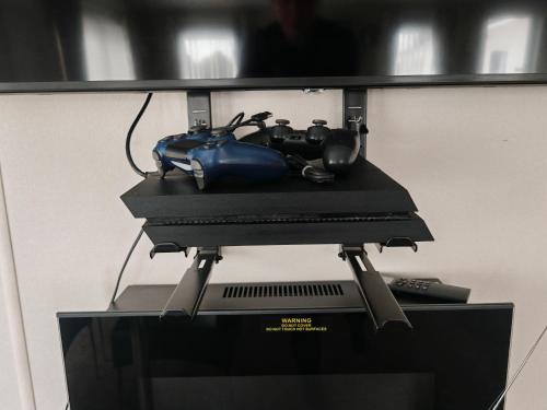 a computer monitor with a joystick and controllers on top at Manor Park Dog Friendly 2 bed, 6 berth Lodge with decking 600 Yard's From The Beach In Hunstanton in New Hunstanton