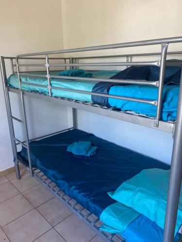 Μία ή περισσότερες κουκέτες σε δωμάτιο στο Maison des Grenadiers