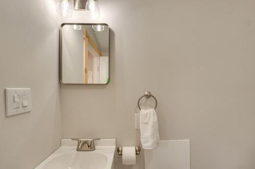a bathroom with a sink and a mirror at Close to Trails Studio with Water Views in Wurtsboro