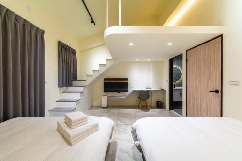 Postel nebo postele na pokoji v ubytování Langchao B&B