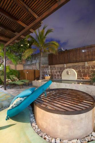 a pool with two blue surfboards in a swimming pool at Casa Abuelita: An exquisite, historic La Paz home in La Paz