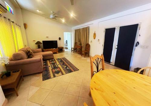 a living room with a couch and a table at Desert Oasis in El Dorado Ranch - San Felipe Resort Rental Home in Playa El Paraíso