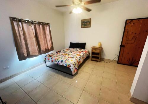 a bedroom with a bed and a ceiling fan at Desert Oasis in El Dorado Ranch - San Felipe Resort Rental Home in Playa El Paraíso