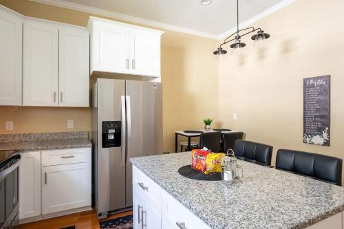a kitchen with a counter top and a refrigerator at Modern 3-bedroom, big fence yard, Pets stay free in Durham
