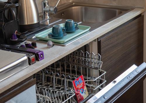 Kuchyň nebo kuchyňský kout v ubytování AC Central Loft