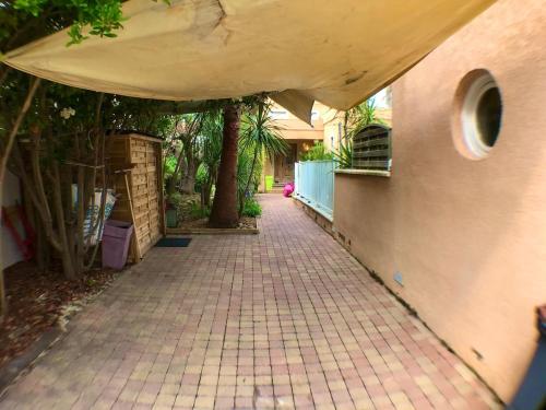 a brick walkway leading up to a house at Luxury house in Agde