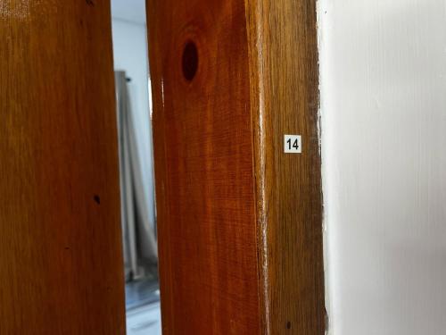 a wooden door with the number on it at Condomínio Residencial Vitória 3 in Sao Paulo