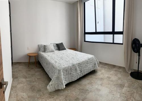 Ένα ή περισσότερα κρεβάτια σε δωμάτιο στο Rodadero Vita 945 Apartasuites