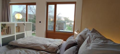 a living room with a couch and a window at Erholen am See in Lychen
