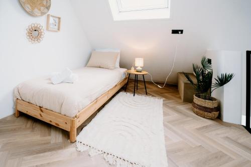 a bedroom with a bed and a rug at Lake House 10 - 4 Person Lake view Apartment! in Offingawier