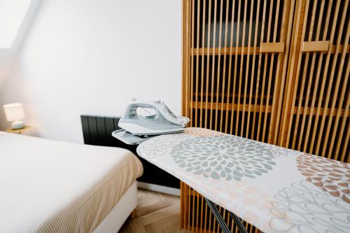a hotel room with a phone sitting on a table at Lake House 10 - 4 Person Lake view Apartment! in Offingawier