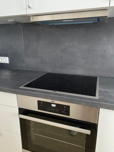 a stove top oven sitting in a kitchen at Ausblick residence in Badenweiler