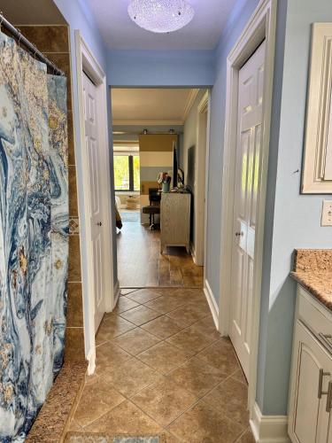 a hallway of a home with a tile floor at Sarasota Charm in Sarasota