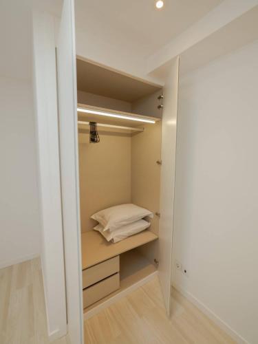 a walk in closet with a bed in it at OPORTO GUEST - Maia House in Porto