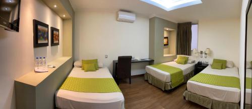 Postel nebo postele na pokoji v ubytování Hotel Ramada