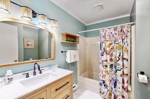 a bathroom with a sink and a shower curtain at Town of Bethany Beach --- 431 Collins St in Bethany Beach