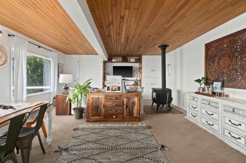 a living room with a wooden ceiling at Cedar & Sage in Tacoma