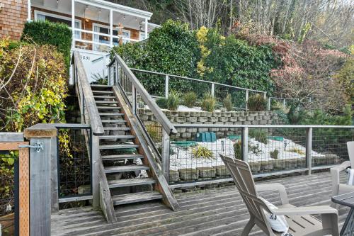 a set of stairs with chairs on a deck at Cedar & Sage in Tacoma
