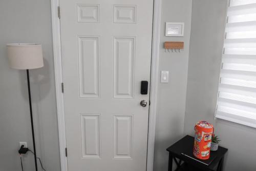 a white door in a room with a table at 3Bed 2Bath Apt Near NYC plus Parking and Laundry in Irvington