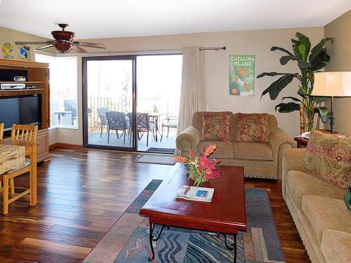 a living room with a couch and a table at 211W 211 Whittley in Avalon