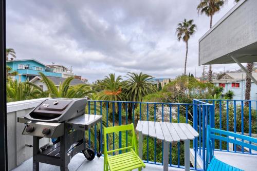 a grill on a balcony with a table and chairs at 217W 217 Whittley Ave in Avalon