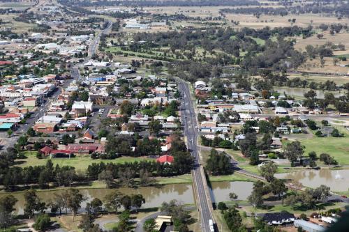 an aerial view of a town with a river at Forbes Victoria Inn in Forbes