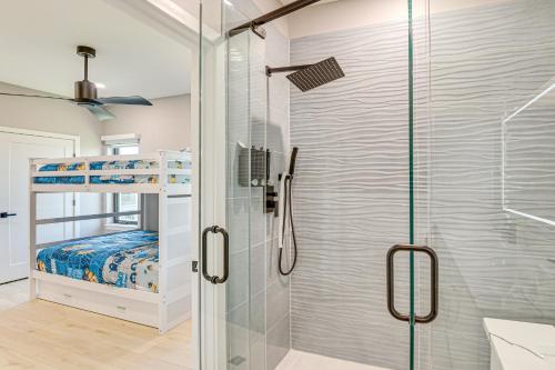 a bathroom with a shower and a walk in shower at Walk to Shore Modern Stunner in Ormond Beach! in Ormond Beach