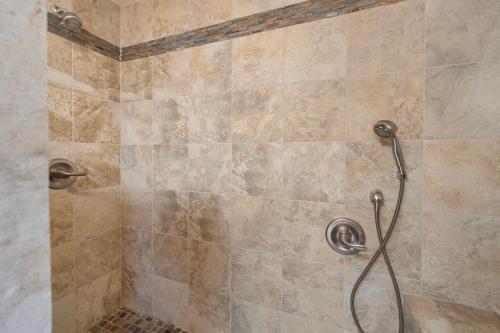 a shower with a hose in a bathroom at 221W 221 Whittley in Avalon