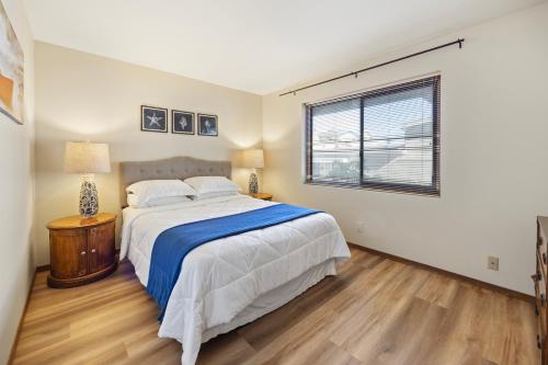 a bedroom with a bed and a window at 221W 221 Whittley in Avalon