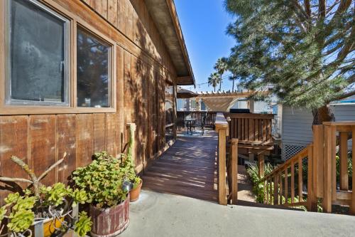 a wooden walkway leading to a house at 221W 221 Whittley in Avalon