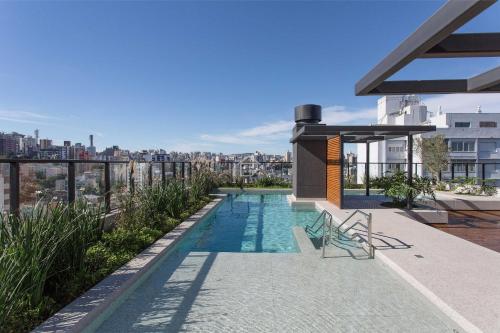 a swimming pool on the roof of a building at GO Rio Branco by Rezervo in Partenon