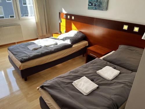 Postel nebo postele na pokoji v ubytování Hotel Tenova Köln-Neumarkt