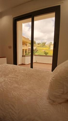 Una cama o camas en una habitación de Villa Perle mémorable séjour vous attendent