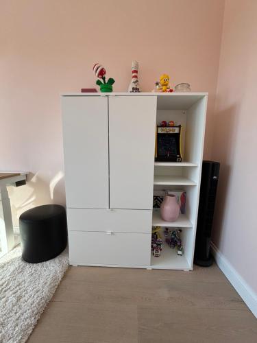 a white cabinet in a room with at Luxury apartment, private terrace & FREE PARKING in Antwerp