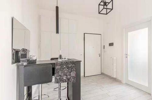 a kitchen with white walls and a counter in a room at Casa centro vista mare in Sassari