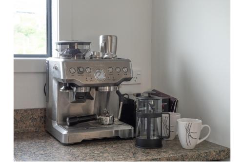 a coffee machine sitting on a counter in a kitchen at Tawa Retreat - Wellington Holiday Home in Wellington