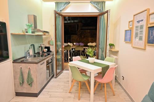 a kitchen and dining room with a table and chairs at Solema Lake Como in Bellano