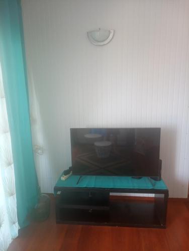 a room with a table with a bowl on it at La résidence du sportif Bernard in Anse-Bertrand