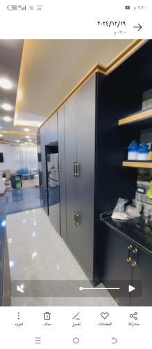 a kitchen with two lockers in a room at فيلا الاحلام in Irbid