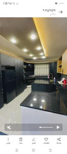 a view of a kitchen with a counter top at فيلا الاحلام in Irbid