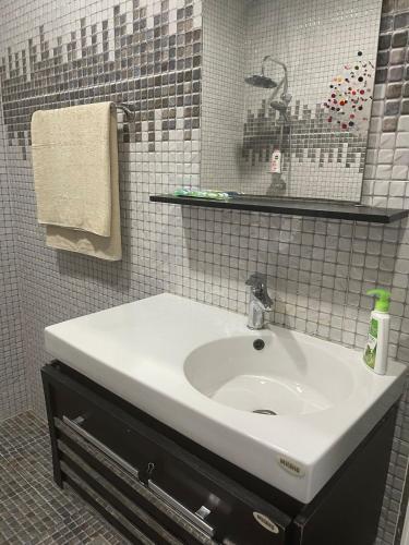 Koupelna v ubytování A Cozy Penthouse Home