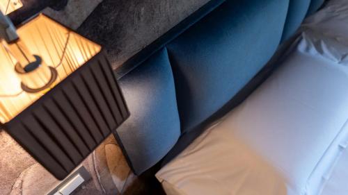 an overhead view of a bedroom with a bed and a table at Hotel Terme Salvarola in Sassuolo