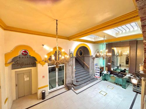 a large room with a staircase in a building at Hotel La Alhondiga in Puebla