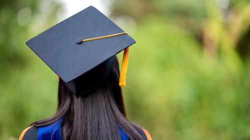 a person wearing a graduation cap and mortarboard at Staybridge Suites Austin Airport by IHG in Austin