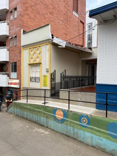 a building with a fence in front of it at Del Rocío Alojamiento -ANDES in Los Andes
