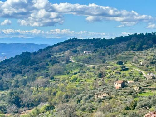 a view of a valley with a road on a hill at Casa Artista in Pedro Bernardo