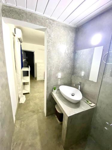 a bathroom with a sink and a mirror at Villa Pierretta in the center, Playa Las Terrenas in Las Terrenas
